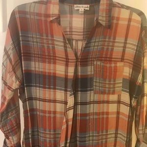 Cute burnt orange plaid top. Diagonal front.